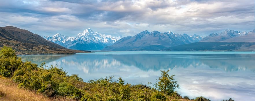 Scenic reflection of Mount Sefton and Mount Cook at lake Pukaki, South Island of New Zealand