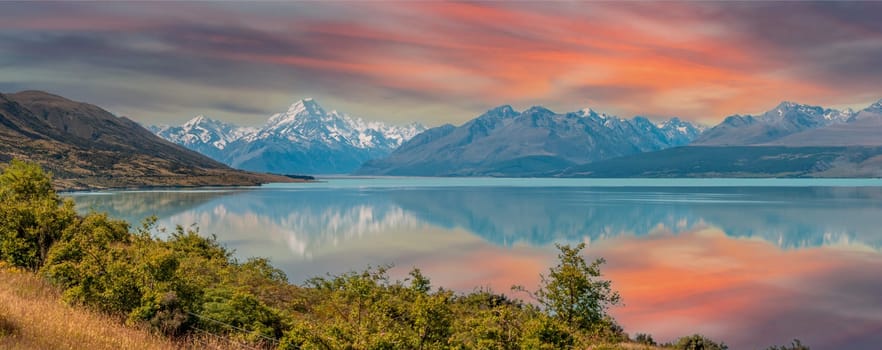 Scenic reflection of Mount Sefton and Mount Cook at lake Pukaki, South Island of New Zealand