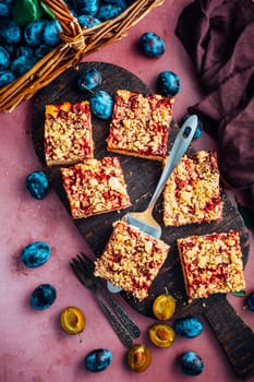 Homemade vegan German plum cake (Zwetschgenkuchen) with yeast dough and crumbles