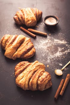 Cinnamon rolls or Franzbroetchen -  Germany sweet pastry sweet pastry baked with butter and cinnamon,  croissant