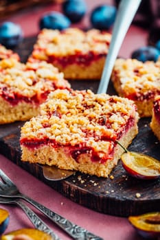 Homemade vegan German plum cake (Zwetschgenkuchen) with yeast dough and crumbles