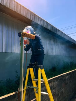 Man welding steel, blurred background, Welder concept, Welding Electrodes,  Filter color style