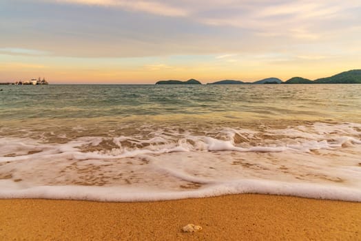 Beach sunset or sunrise with colorful of cloud sky and sunlight in evening light
