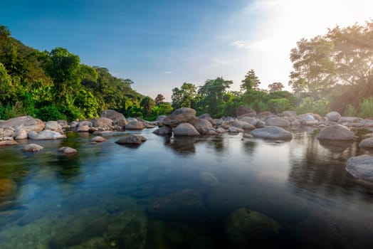 River stone and tree with sun light, View water river tree, Stone river and sun ray in forest
