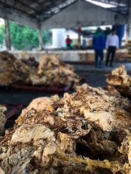 Latex Rubber, Rubber left over from the latex production process to be used to make other materials blurred background