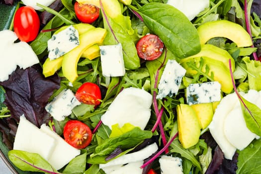 Diet salad of fresh vegetables, herbs and cheese. Healthy food