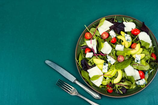 Diet salad of fresh vegetables, herbs and cheese. Healthy food