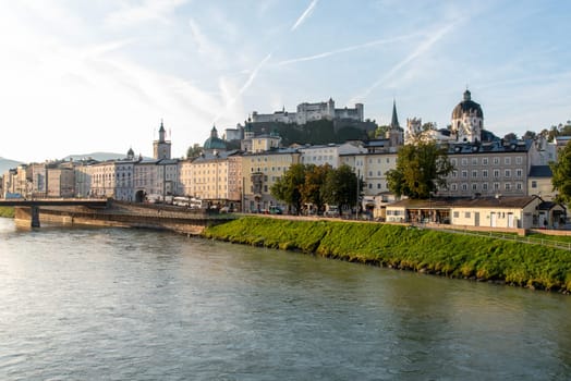 The first Sunbeams of a day over Salzburg, view of the Castle Hohensalzburg, Austria