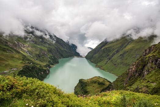 Scenic panoramic view from the reservoirs and its alpine landscape near Kaprun in the Austrian Alps