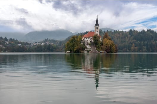 Peaceful view on lake Bled and the island with its pilgrimage church Assumption of Mary, The Slovenian Alps