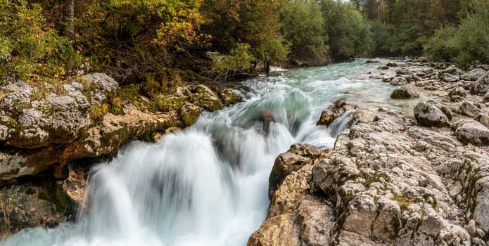 The Soca river flowing through a wild mountain landscape of the Julian Alps, Slovenia