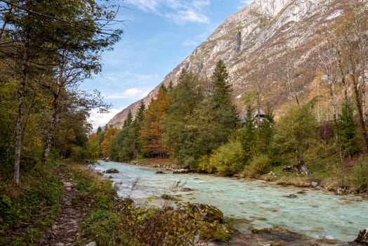 The Soca river flowing through a wild mountain landscape of the Julian Alps, Slovenia