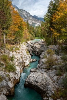 The Soca river flowing through a wild mountain landscape of the Julian Alps, Slovenia