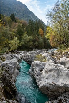 The Soca river flowing through a wild mountain landscape of the Julian Alps, Slovenia