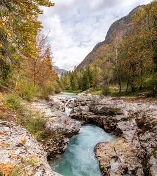 The Soca river flowing through a wild mountain landscape of the Julian Alps, Slovenia
