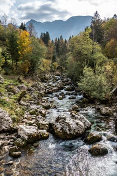 The Soca river flowing through a wild mountain landscape of the Julian Alps, Slovenia