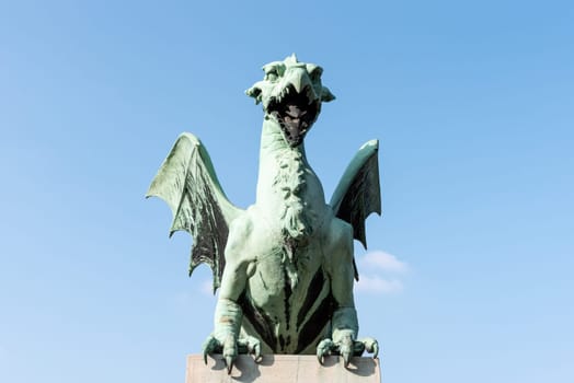 A dragon statue on the Dragon Bridge, symbol of the city of Ljubljana, Slovenia