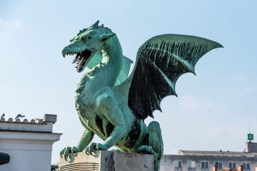 A dragon statue on the Dragon Bridge, symbol of the city of Ljubljana, Slovenia