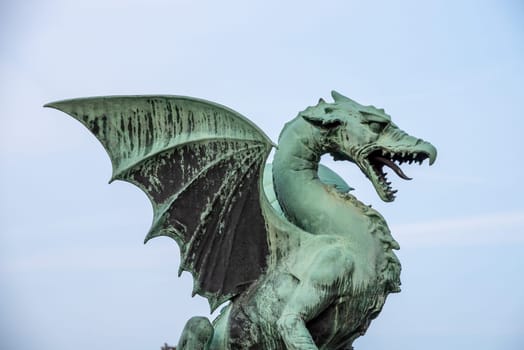 A dragon statue on the Dragon Bridge, symbol of the city of Ljubljana, Slovenia