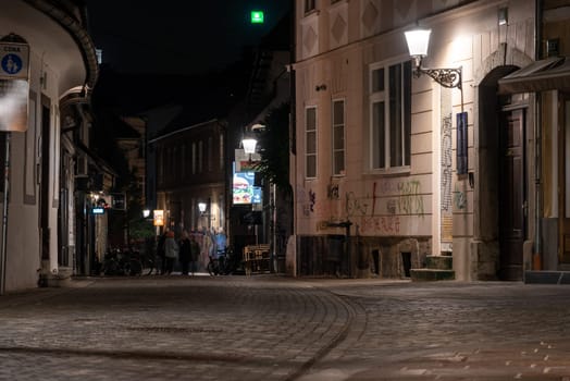 Scenic abandoned alley Trubarjeva in the city center of Ljubljana at night, Slovenia