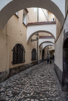Small alley leading to the fish market in the center of Ljubljana, Slovenia