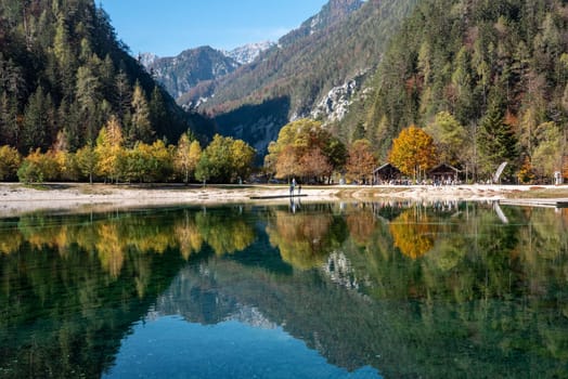 Scenic autumn forest at Crystal Lake in the Julian Alps, Slovenia