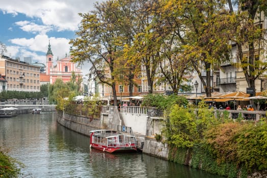Promenade at the Ljubljanica river in downtown Ljubljana in autumn, Slovenia