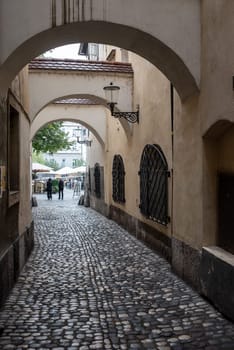 Small alley leading to the fish market in the center of Ljubljana, Slovenia