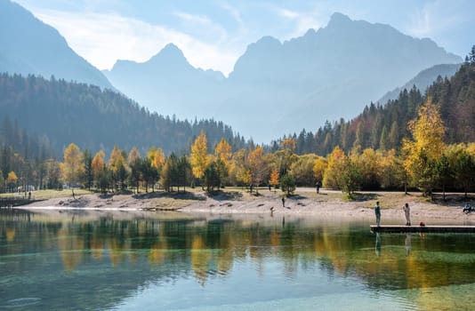 Scenic autumn forest at Crystal Lake in the Julian Alps, Slovenia