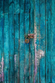 Old lock on the door. lock on the door of an old farmhouse. true village style.