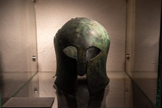 Old Roman helmet in a museum in Southern Italy