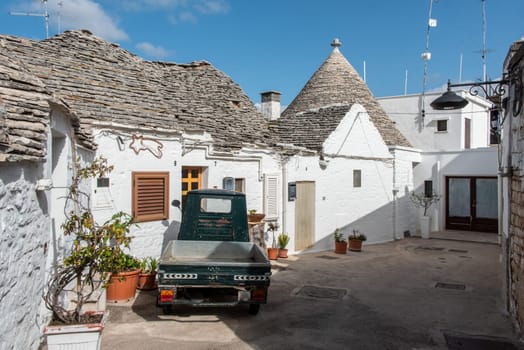 Iconic residential houses in historic Trulli district in Alberobello, Italy