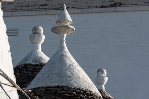 Iconic residential houses in historic Trulli district in Alberobello, Italy