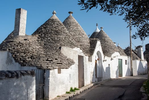 Iconic residential houses in historic Trulli district in Alberobello, Italy