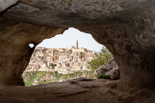 Scenic view of historic downtown with its cathedral, photo taken from a cave house, Italy
