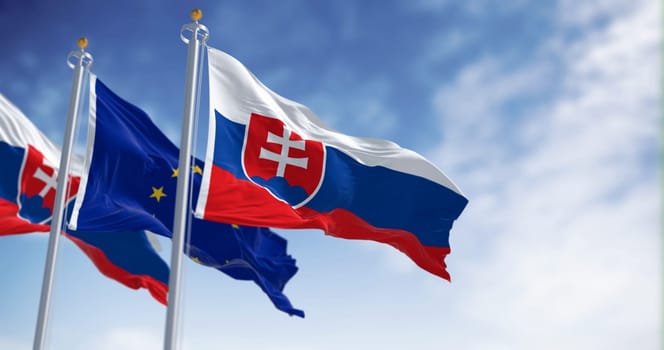 The flags of Slovakia and the European Union fluttering together on a clear day. Slovakia has been a member of the eurozone since January 1, 2009. 3D illustration render. Fluttering fabric