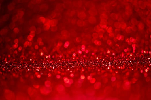Abstract blur red glitter background card for Valentine's day, christmas and wedding celebration. Love bokeh sparkle confetti textured layout. Modern elegant design.