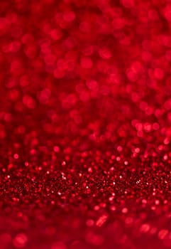 Abstract blur red glitter background card for Valentine's day, christmas and wedding celebration. Love bokeh sparkle confetti textured layout. Modern elegant design.