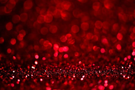 Abstract blur red glitter background card for Valentine's day, christmas and wedding celebration. Love bokeh sparkle confetti textured layout. Modern elegant design.
