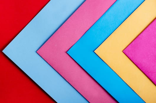 Trendy pastel colors in geometry shape flat lay. Colorful rainbow paper creative linear background. Abstract minimal vivid art design.