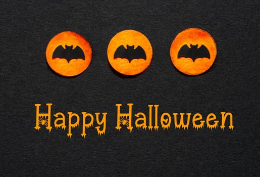 Black Halloween Background With Three Orange Dots With Bats And Text Happy Halloween