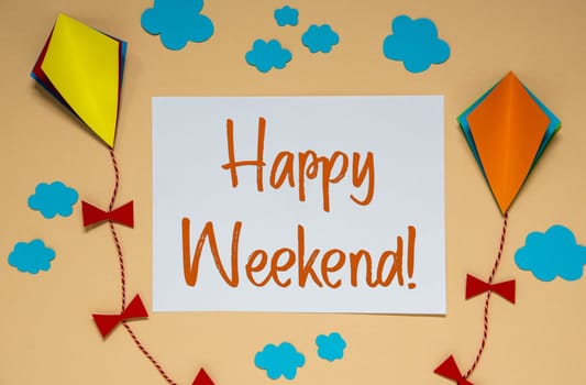 Autumn Background With Paper Kites, Clouds and Fall Decoration, With Text Happy Weekend