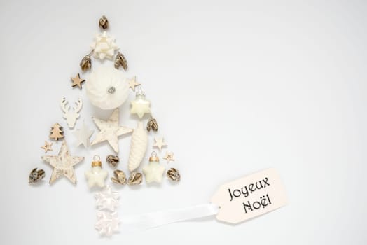 Whiter Background With A Christmas Tree Out Of Christmas Decoration, With A Label With French Text Joyeux Noel, Which Means Merry Christmas In English