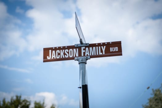 October 08 2018 : sign of the Jackson family Blvd near the family 's Michael Jackson house. The famous star was here with his siters and brothers when he as young in Gary city. Gary city is near Chicago.
