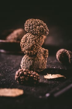 Expensive black truffles gourmet mushrooms  on kitchen table