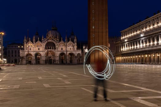 Painting a Circle with Light at the St Mark's Square, Venice, Italy