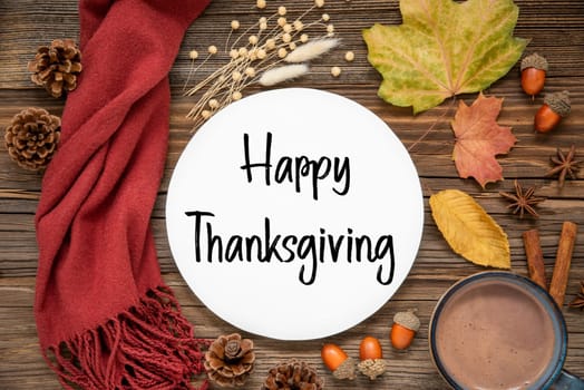 Autumn Decoration, Flat Lay With Colorful Maple Leaves, Cozy Atmosphere and Label With Text Happy Thanksgiving