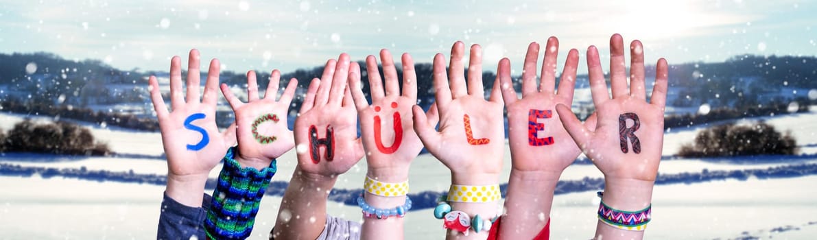 Children Hands Building Colorful German Word Schueler Means Pupil. White Winter Background With Snowflakes And Snowy Landscape.