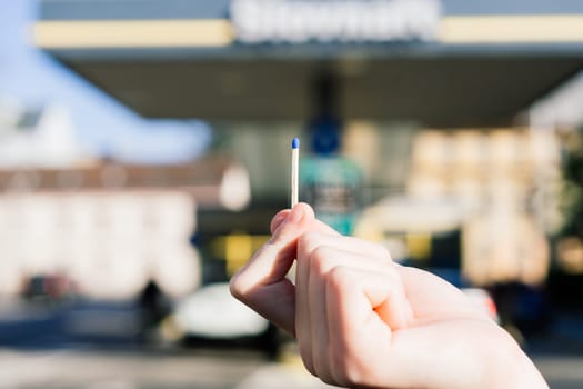 Set fire to spilled oil, drawing carefully flammable. Matches fire in front of a fuel station