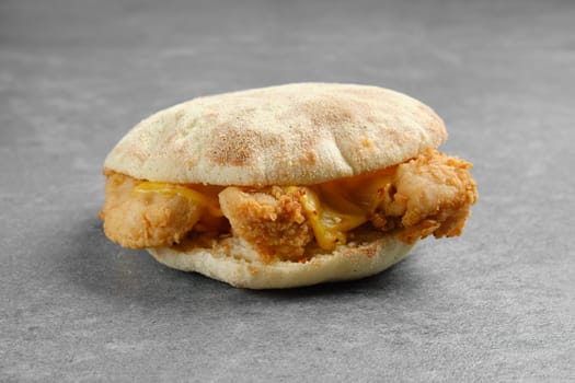 Pita bread with chicken nuggets and melted cheese